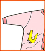 View of half a baby's yellow top with an orange pepper shaped illustration